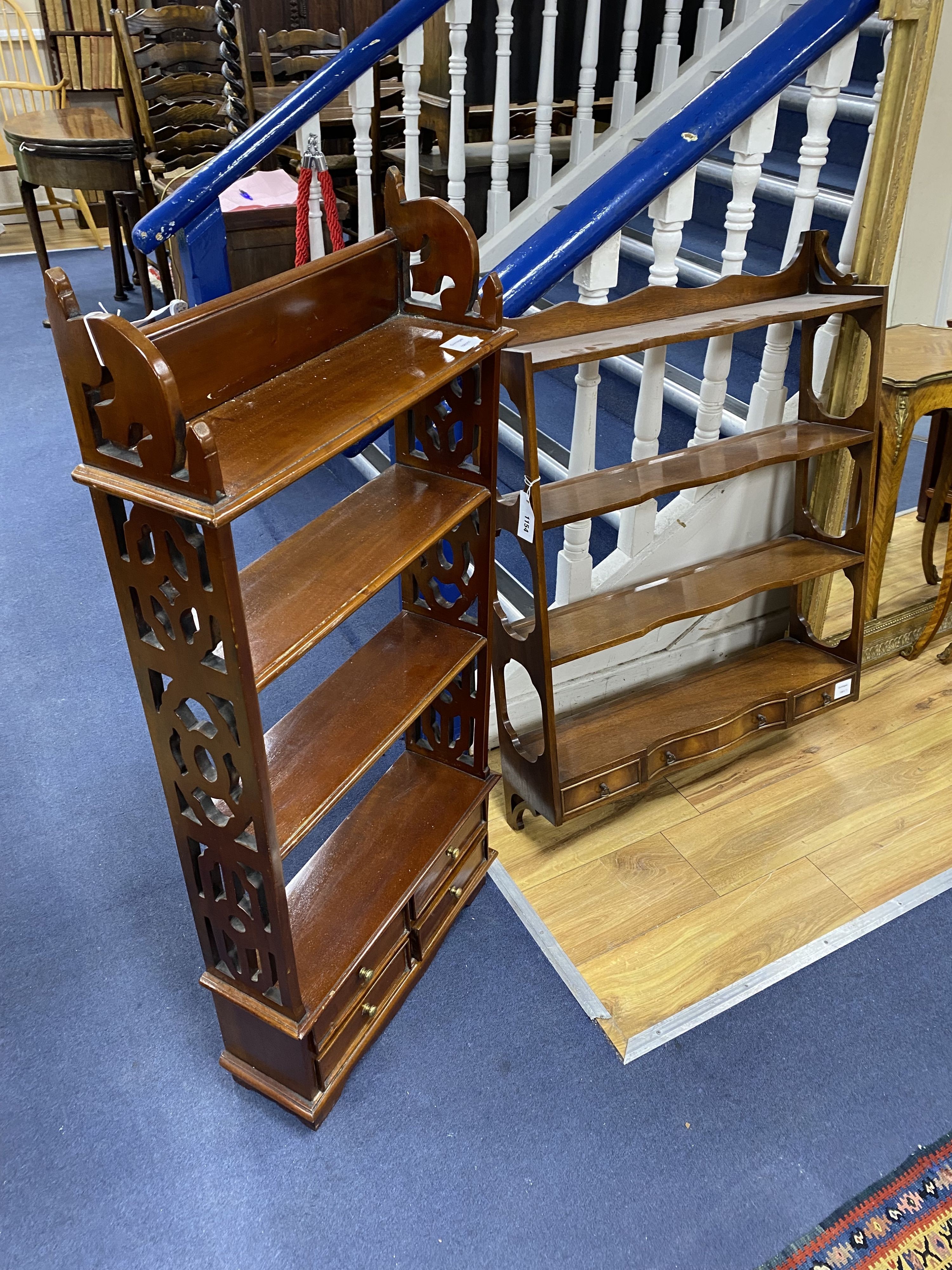Two mahogany wall brackets, larger width 69cm, height 93cm